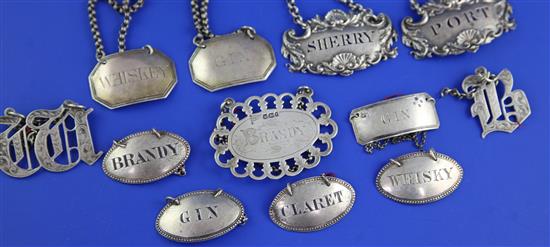 Twelve assorted 19th century silver wine labels, 2.5in et infra.